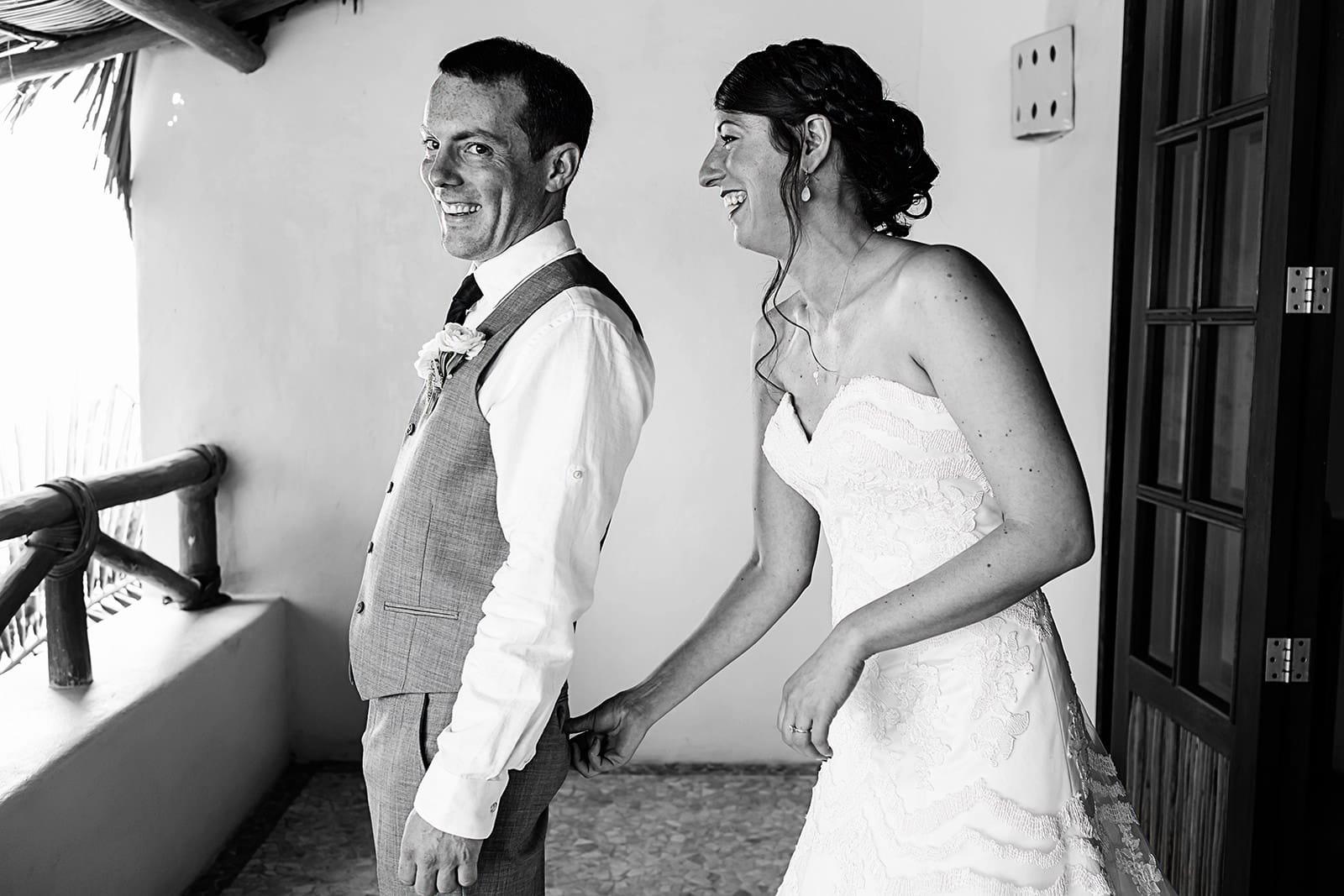 Bride pinch groom's butt as cue to their first look in the balcony 