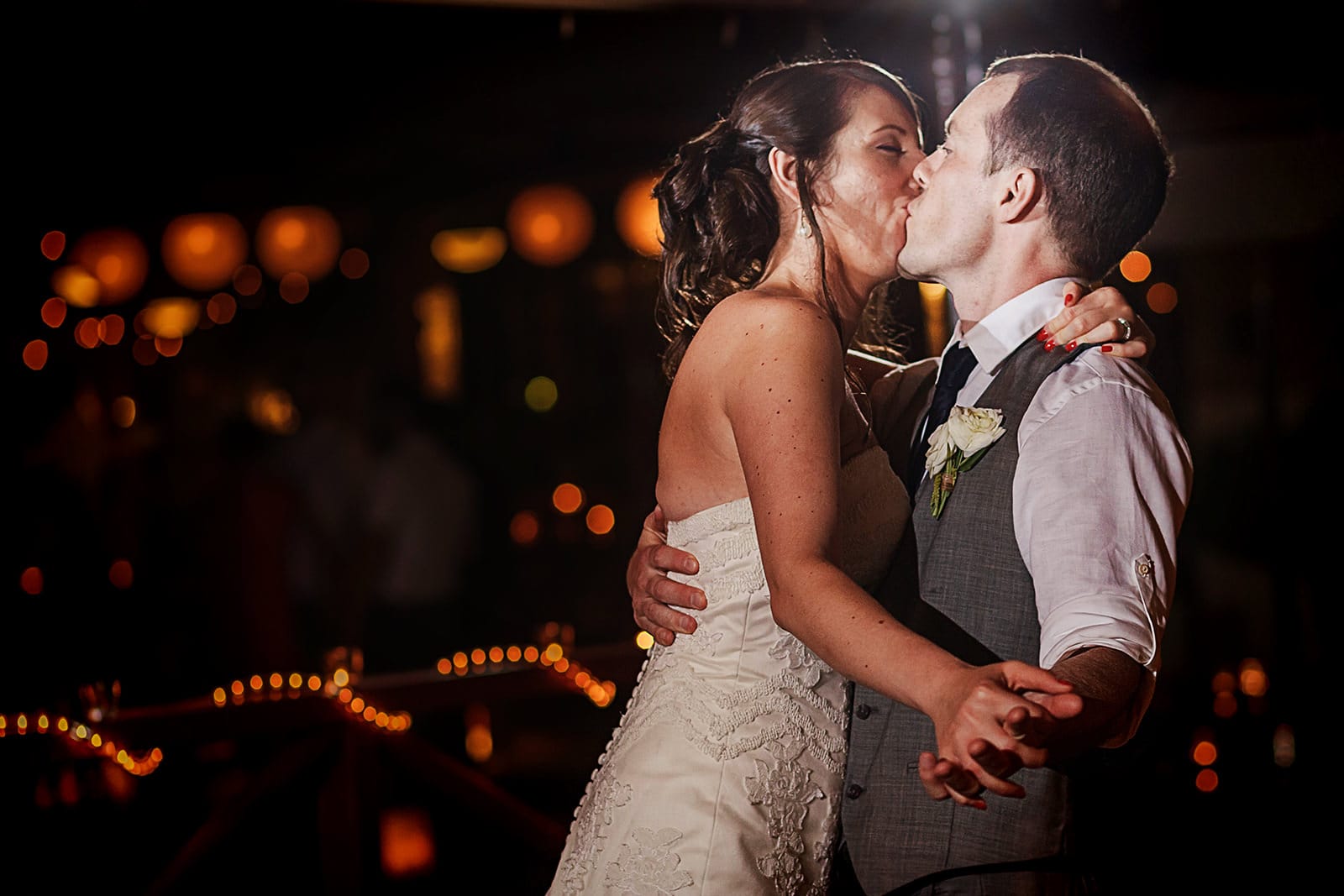 Wedding couple kiss on their first dance at reception in Playa Fiesta Mexico