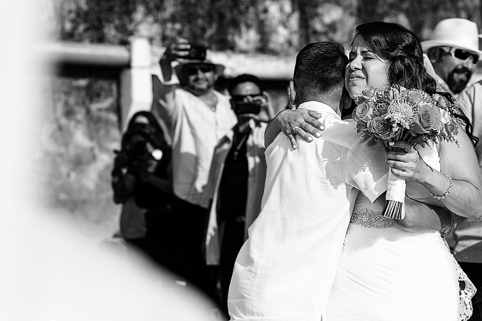 Bride hug her son at the end of the aisle for wedding ceremony to start