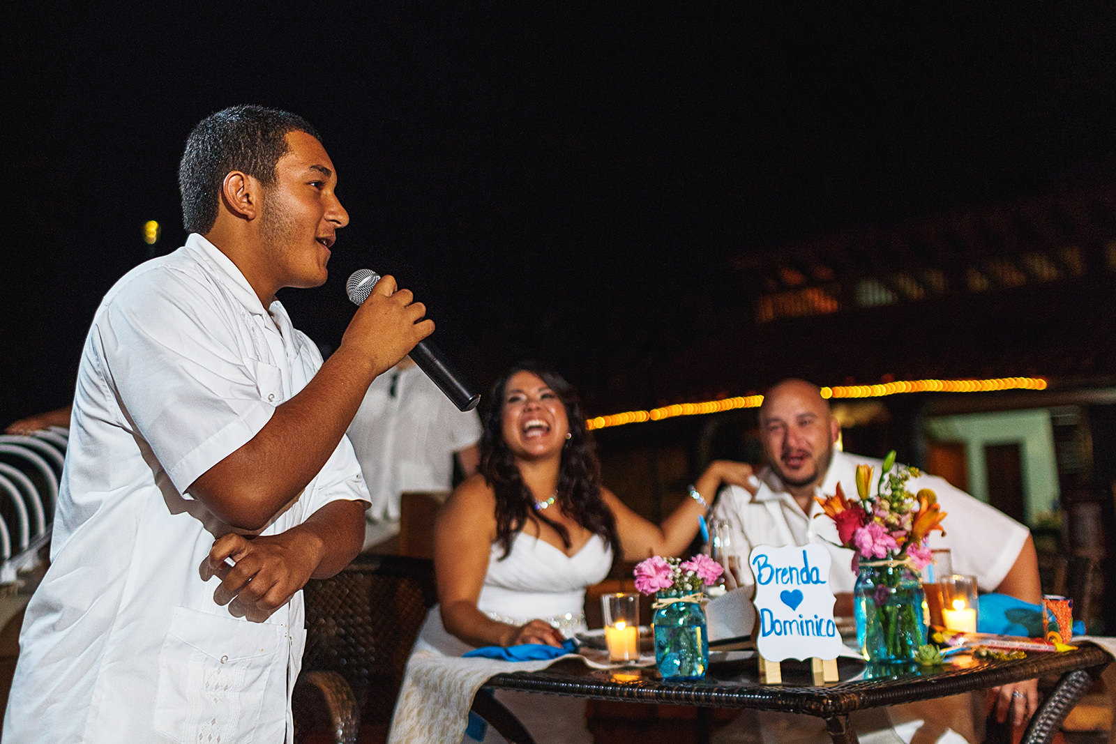 Guest, bride and groom during speech at Villa Celeste