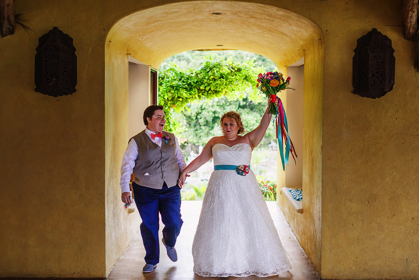 LGBTQ same sex wedding couple entrance to the reception area