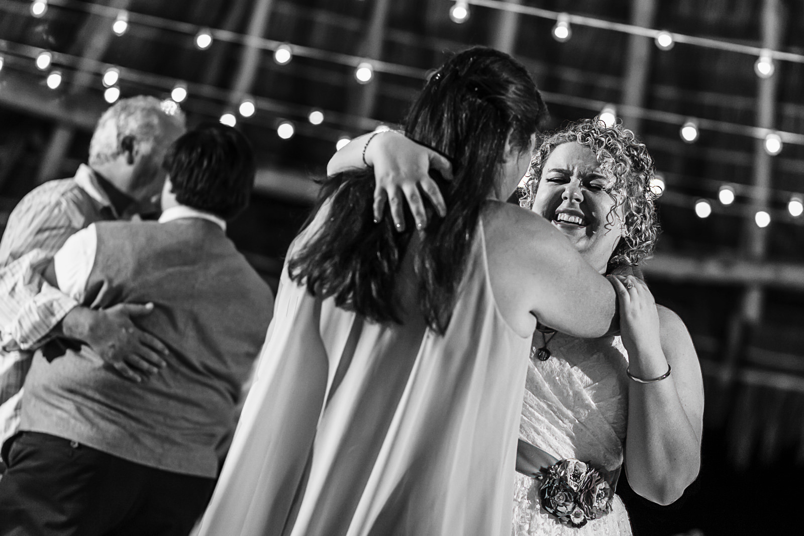 Bride dancing with mother-in-law at wedding reception