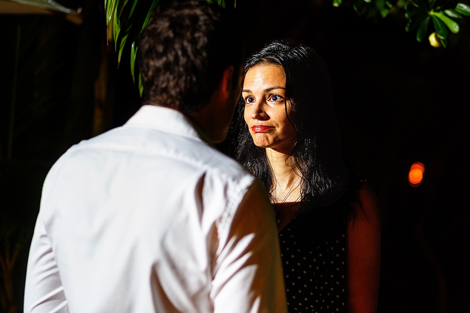 Reaction of a young woman while hearing the marriage proposal his fiancé is saying