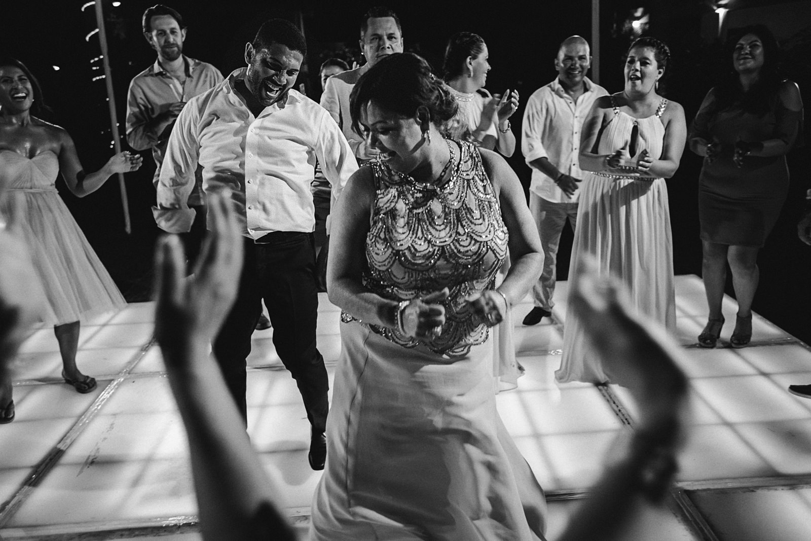 Mother of the bride and guest dancing inside the circle