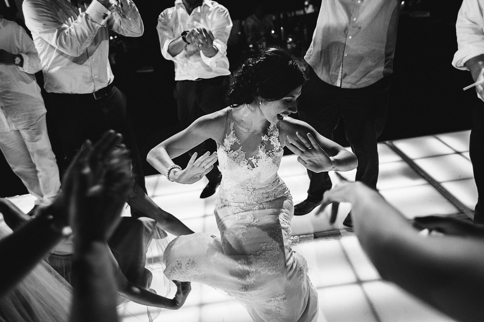 Bride showing off her best moves on the dance floor at her wedding reception party