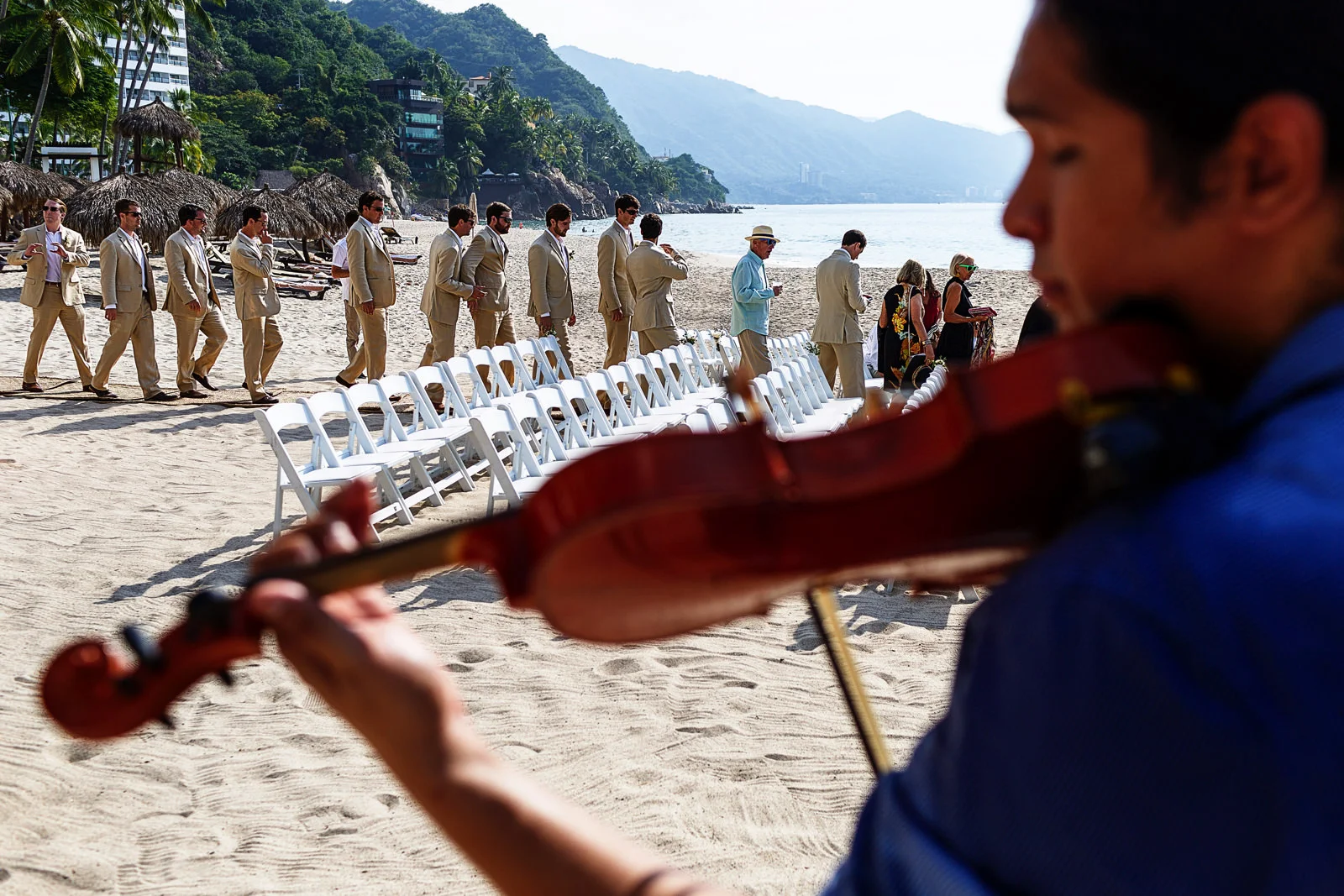 A violinist plays while the groomsmen and groom take their place for wedding ceremony - Eder Acevedo cancun los cabos vallarta wedding photographer