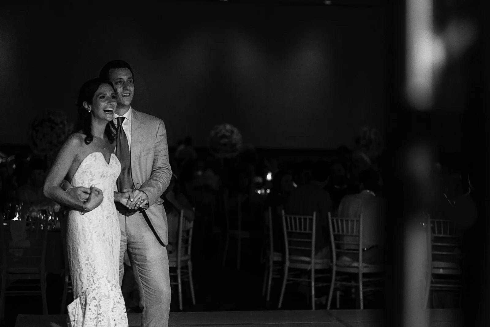Couple reaction to bridesmaid singing "At last" on stage during wedding reception - Eder Acevedo cancun los cabos vallarta wedding photographer