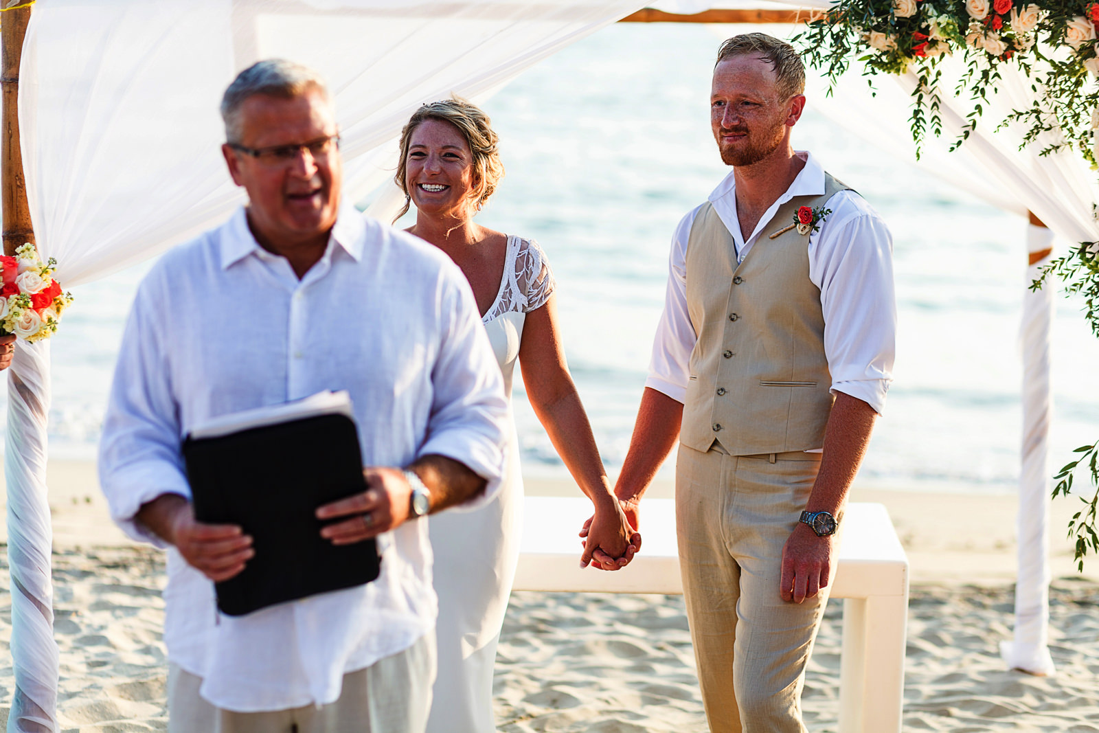 Bride and groom during wedding ceremony on Bucerias beach Nayarit Mexico