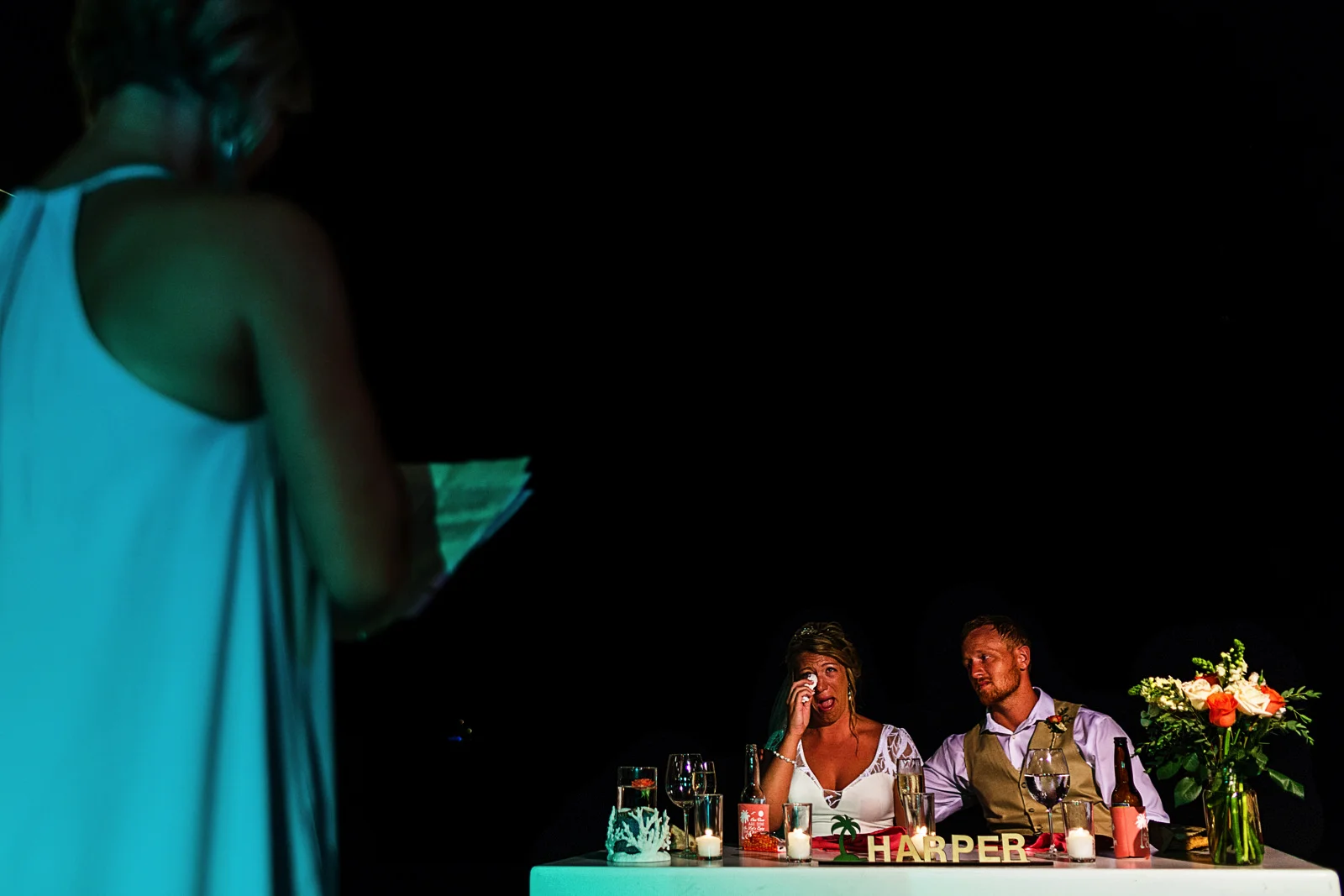 Bride crying during aunt's speech and toast at destination wedding reception