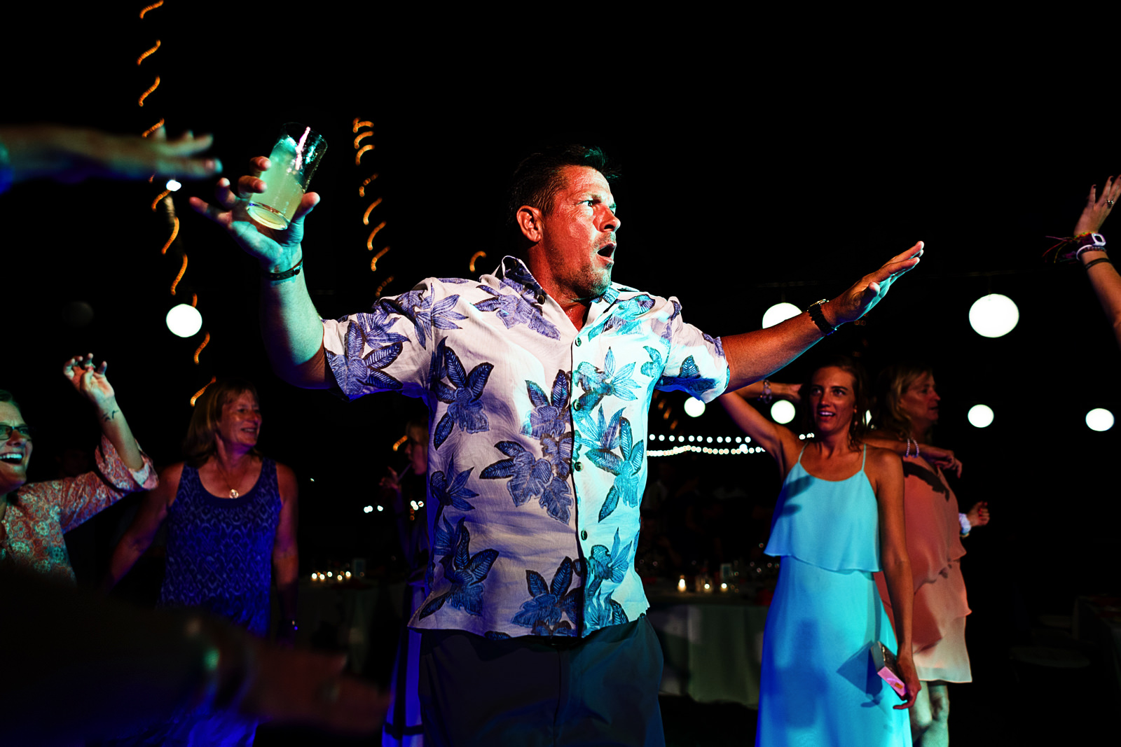 Wedding guest bringing his best moves into the dance floor during wedding reception