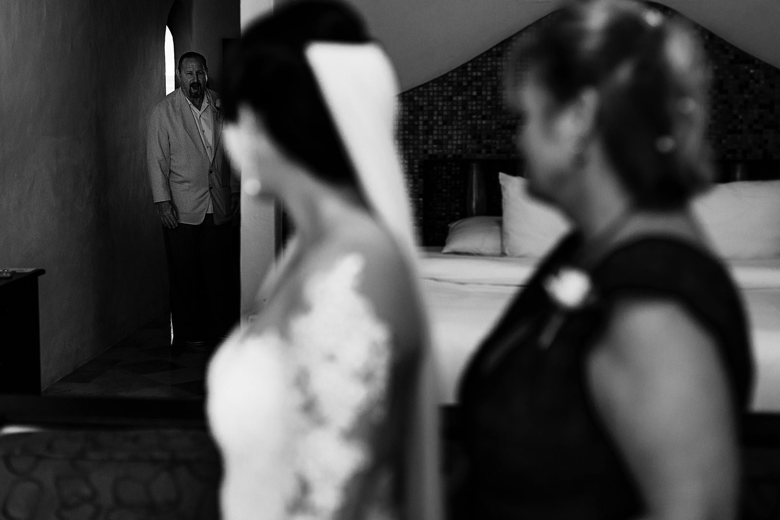 Father of the bride walking into the bridal suite before the ceremony