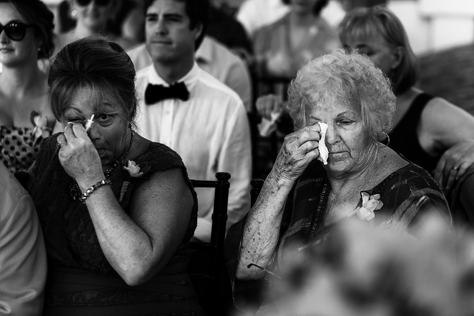 Mother and grandmother of the bride crying during the wedding ceremony