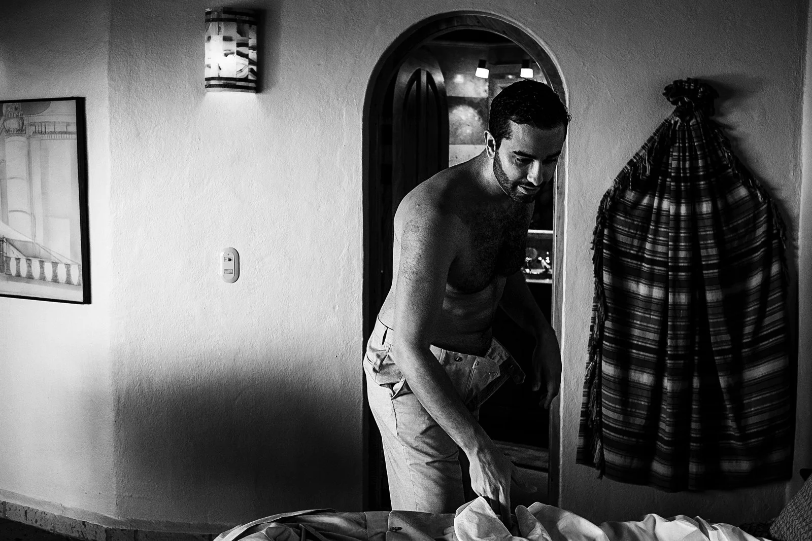 Groom getting dressed