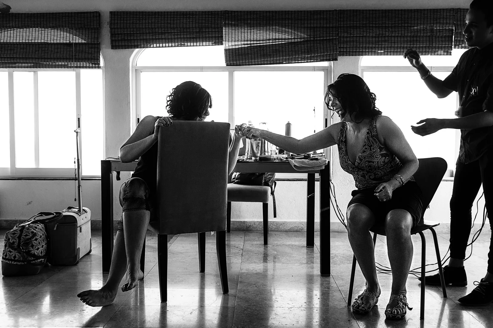 Aunt and mother of the bride do a fist bump