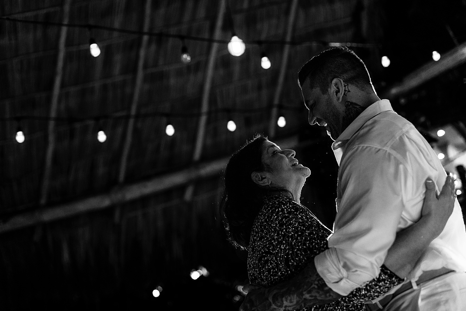 The groom dance with his mother at the wedding reception