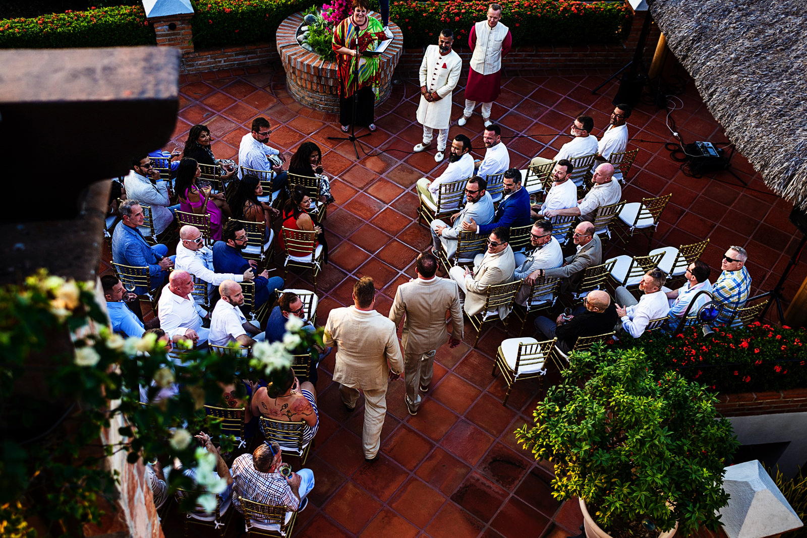 Above view at the ceremony entrance, the groom and best man walking down the aisle