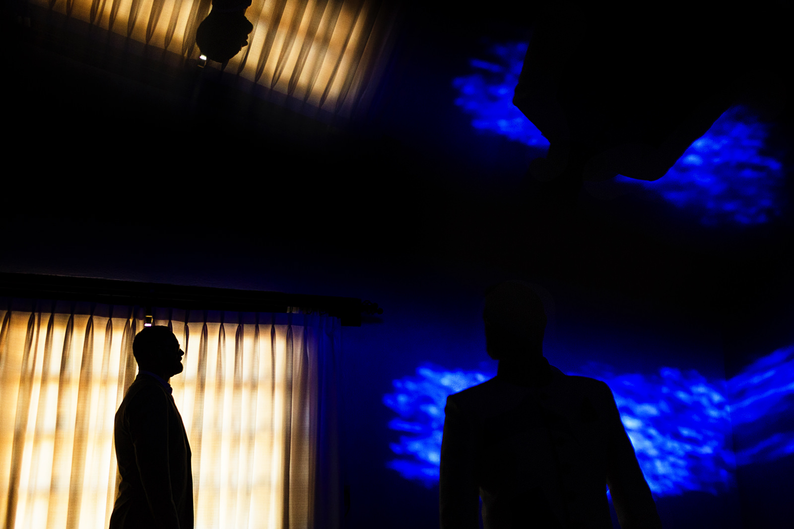 Abstract portrait of gay couple in yellow and blue with silhouettes