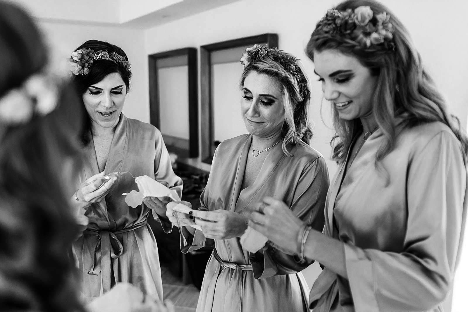 Bridesmaids receiving a little gift from the bride