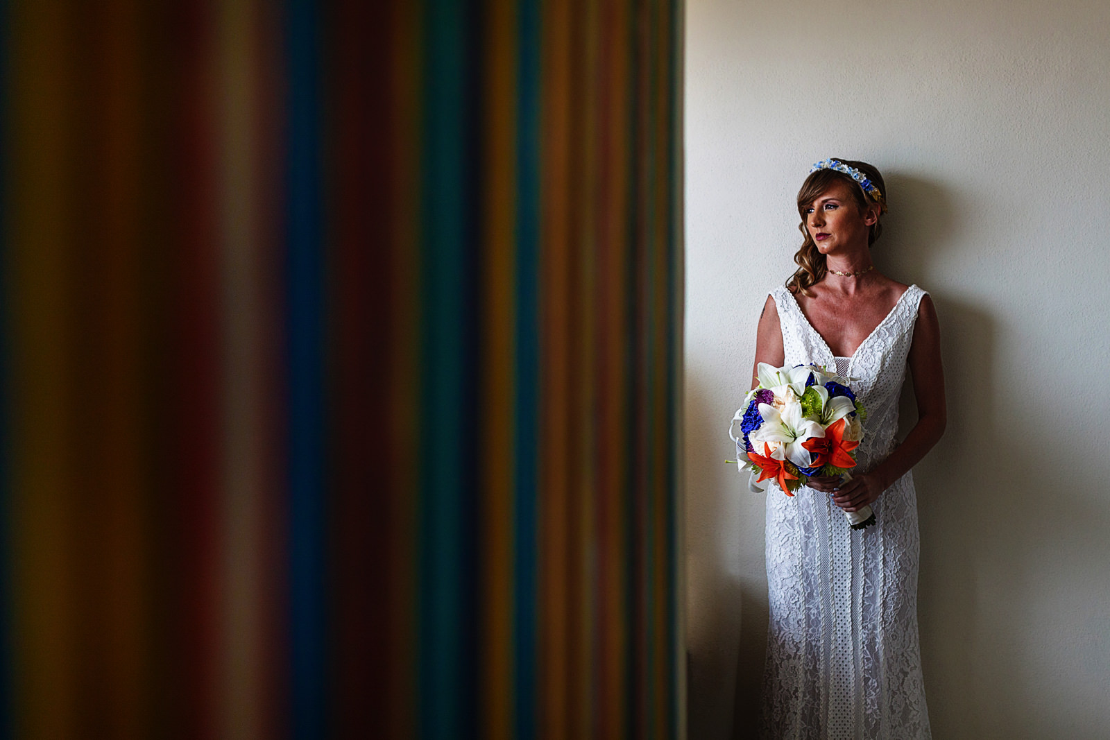 Colorful portrait of the bride light up by the window