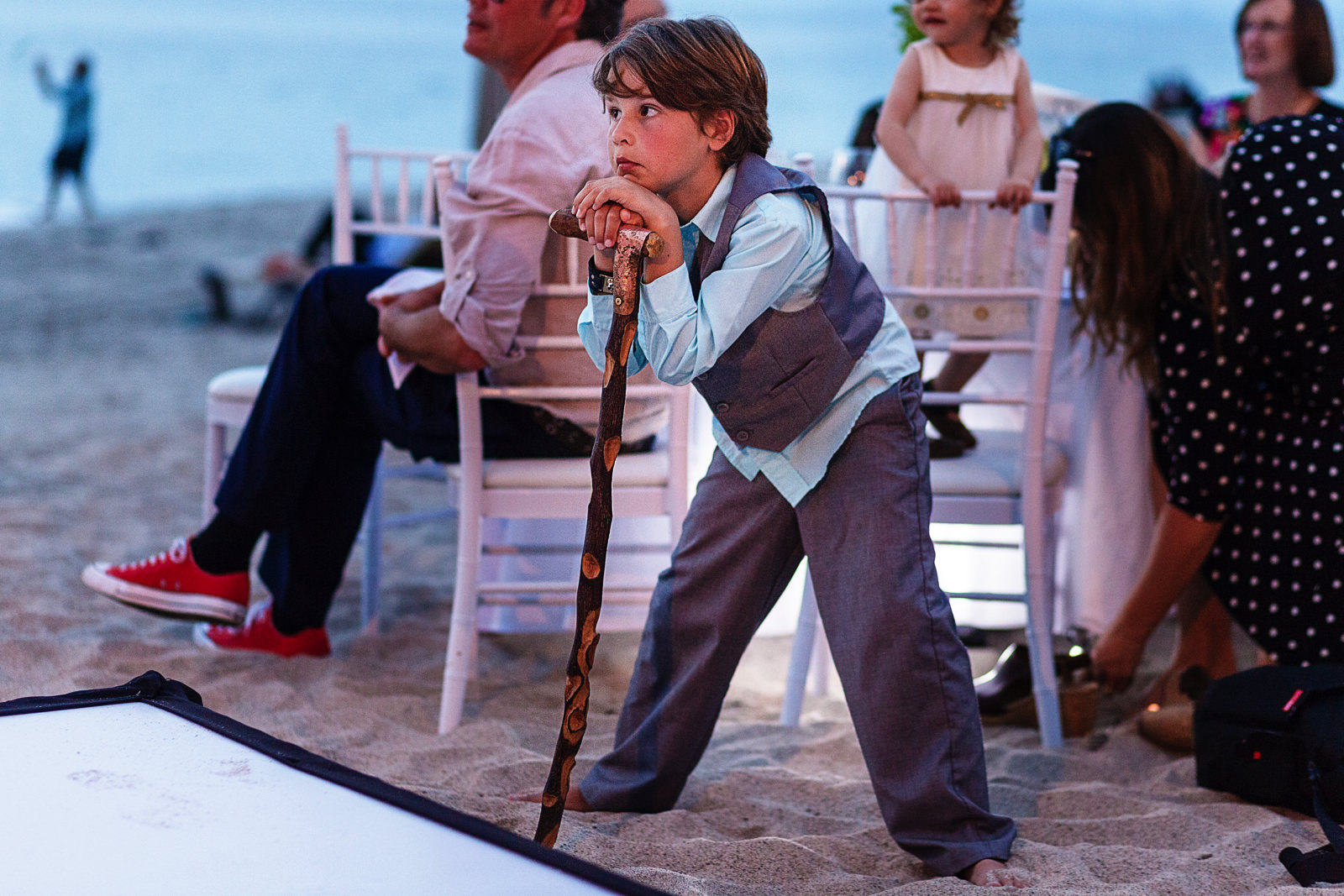 Kid leans on a cane during speeches