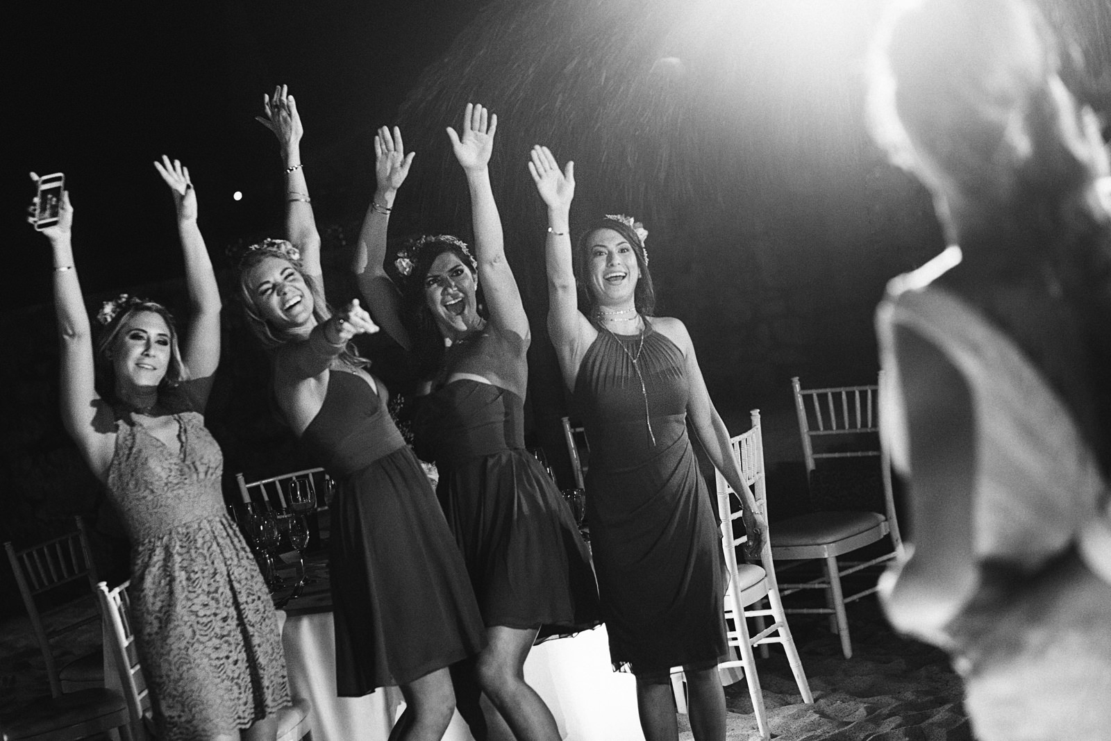 Bridesmaids cheer for the couple duirng their first dance