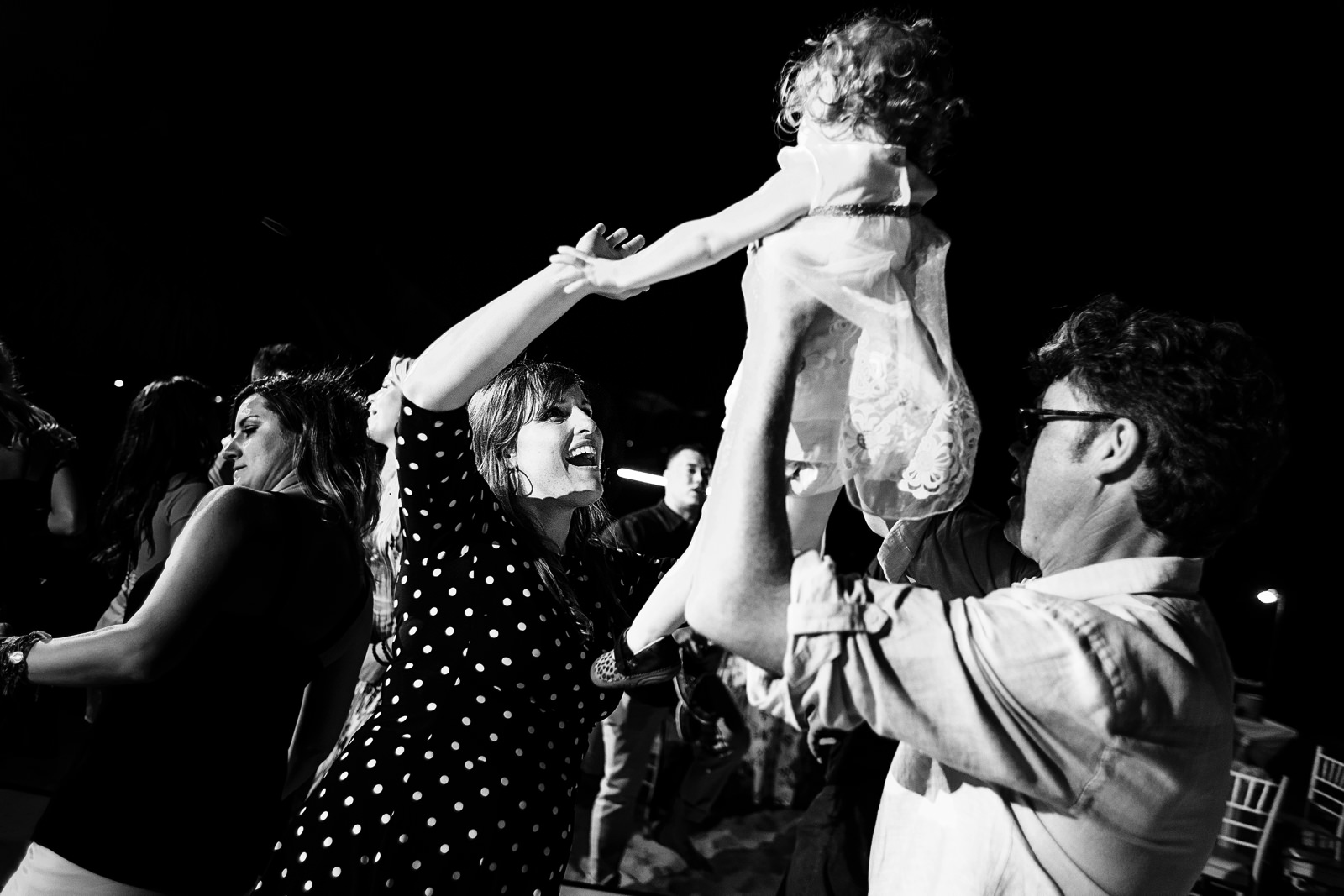 Wedding guests dancing during the party