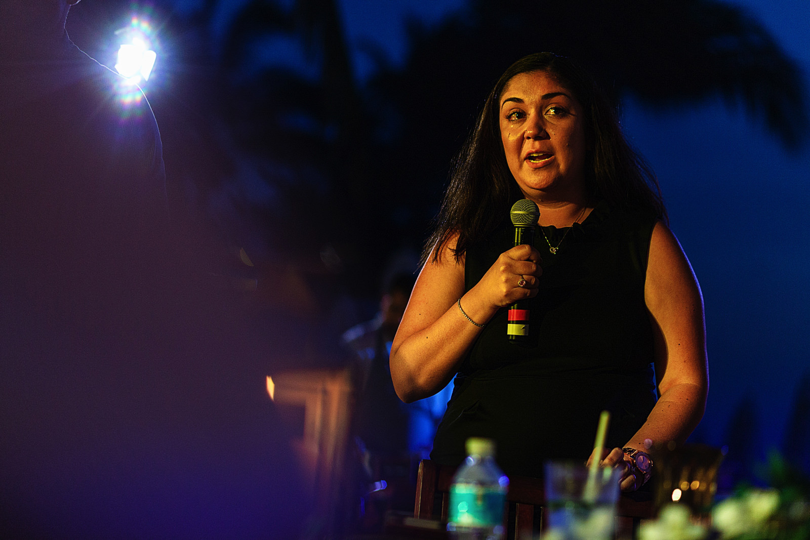 Sister of the bride crying while giving a speech during the rehearsal dinner.