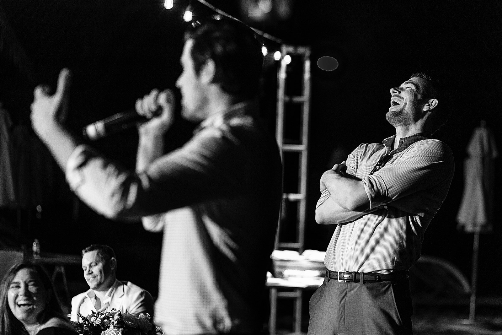 Wedding male guest reaction during a speech.