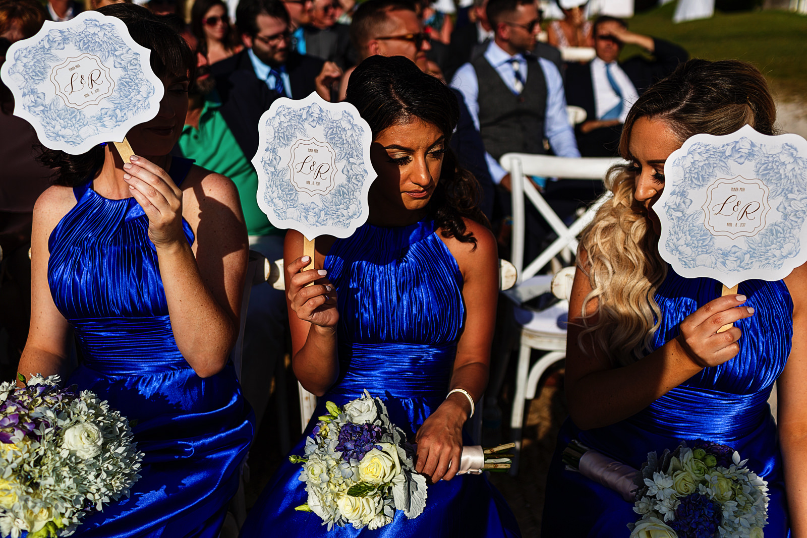 Light and heat from the sun hits hard on the bridesmaids during the wedding ceremony on the beach at the St. Regis Punta Mita Resort.