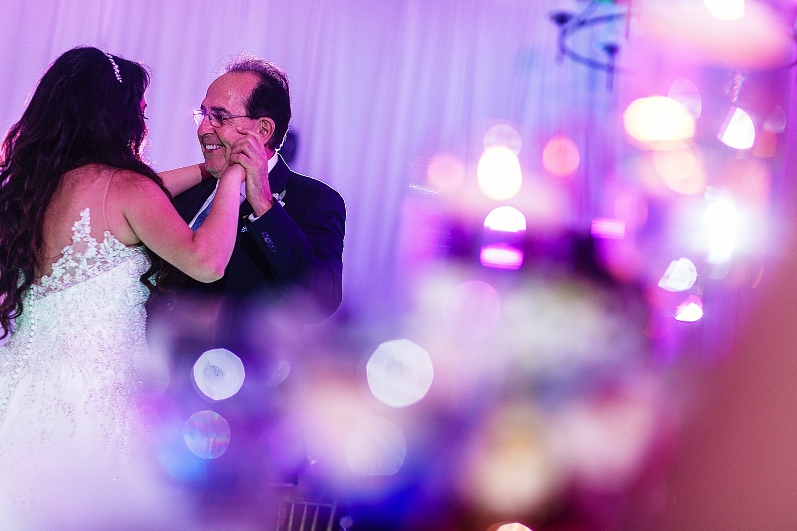 Bride and her dad dancing during the wedding reception.