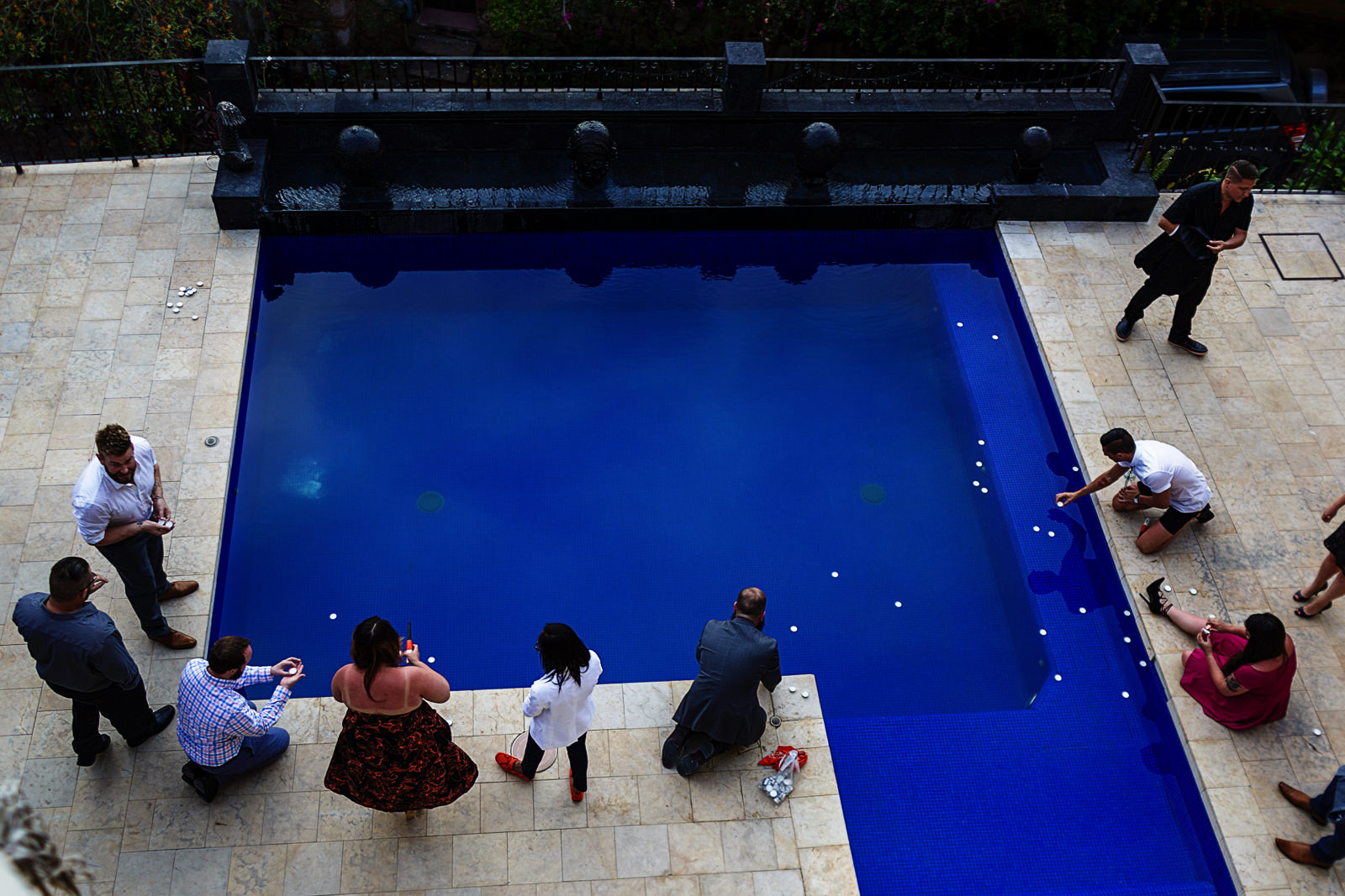 guests-lighting-candles-pool