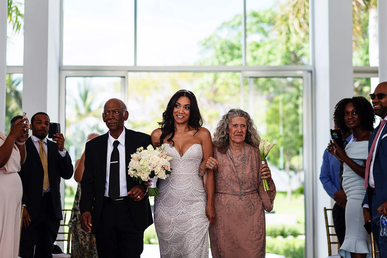 bride-walking-down-aisle-with-parents