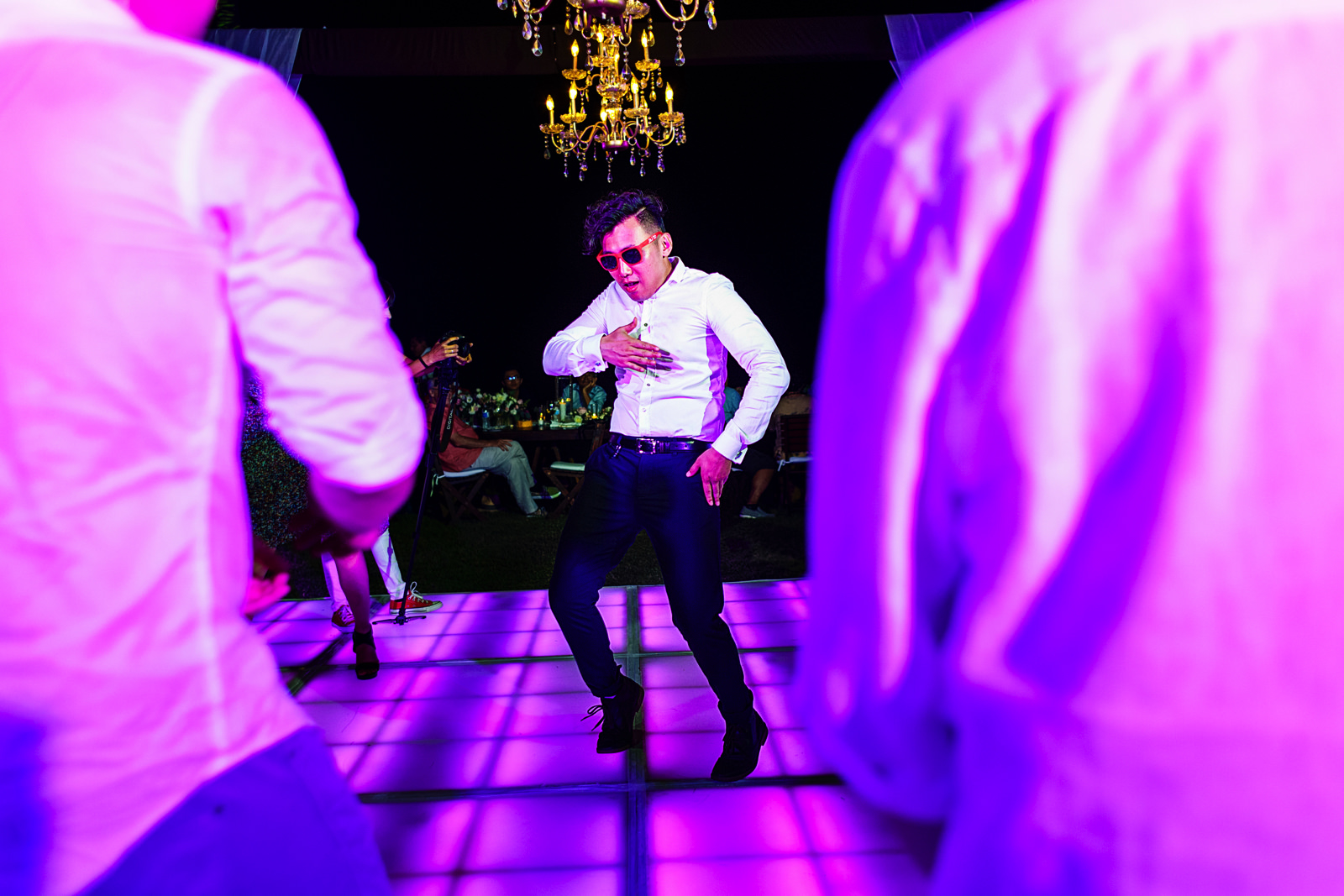 Wedding guest bringing super cool dance moves during the destination wedding party.