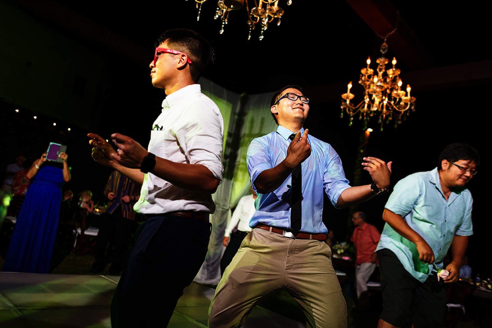 Wedding guests singing, dancing and enjoying the destination wedding reception.