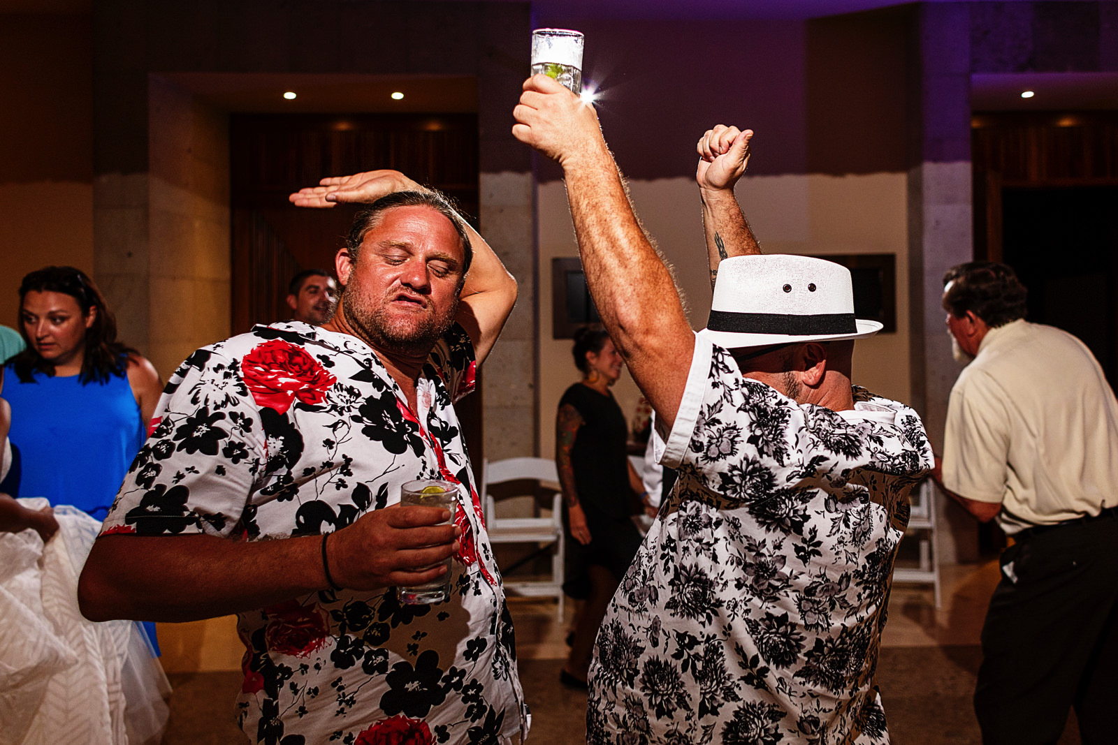Wedding guests going bananas in the dance floor at the party