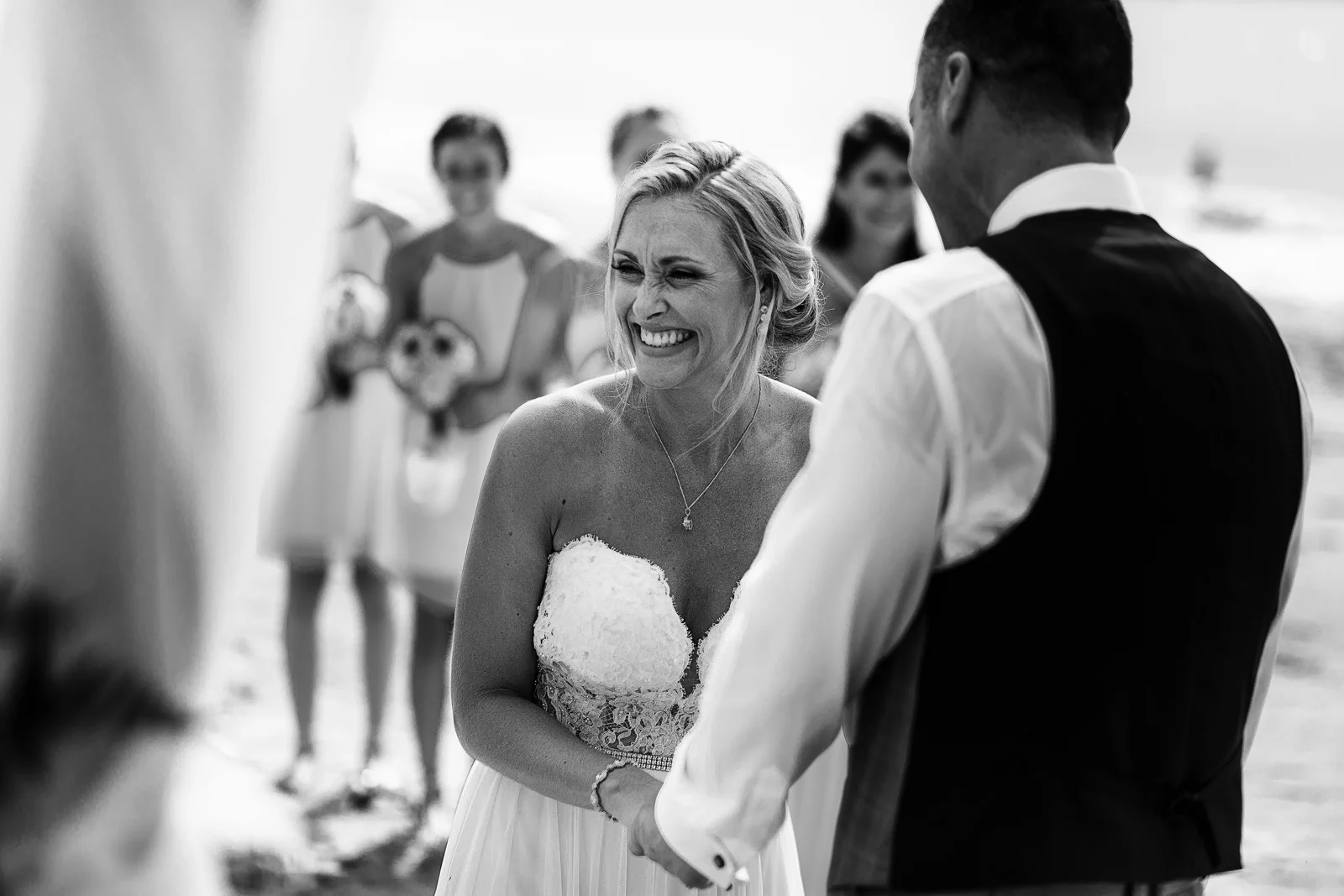 Bride laughing during her wedding ceremony