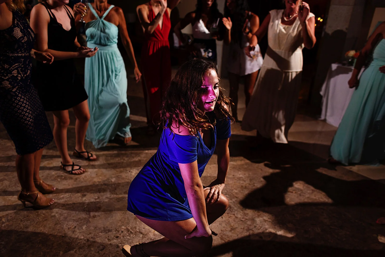 Wedding guest going down to the floor while dancing