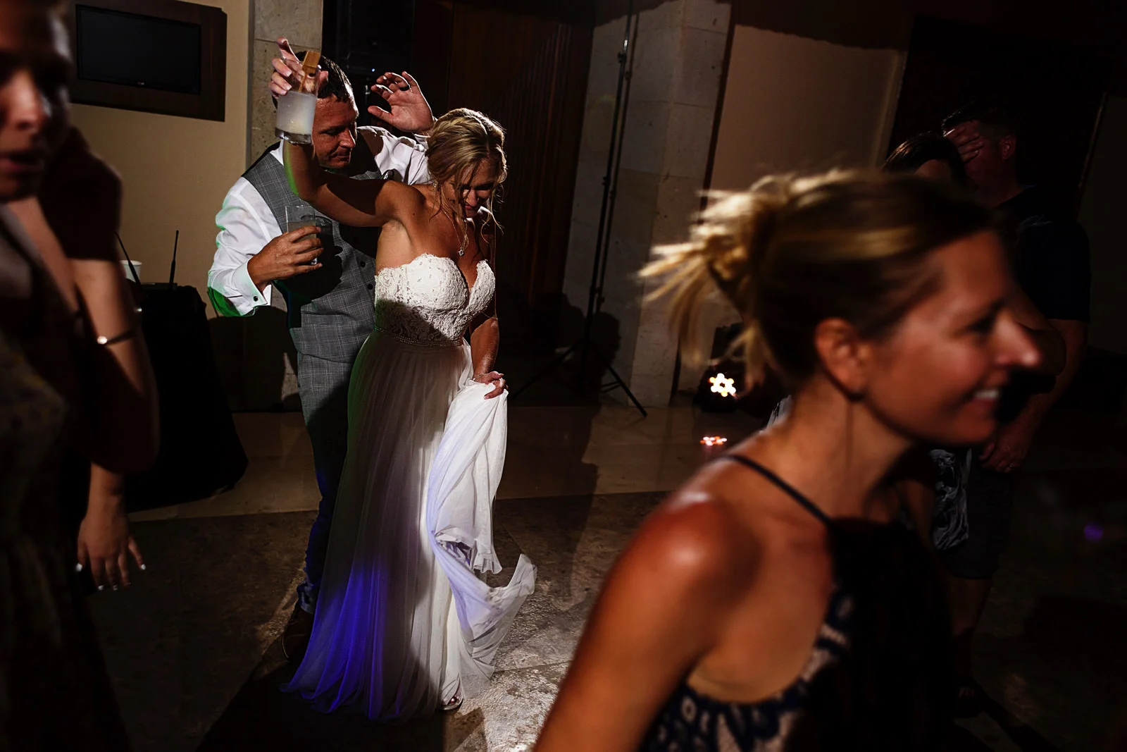 Groom and bride dancing during their wedding's party time