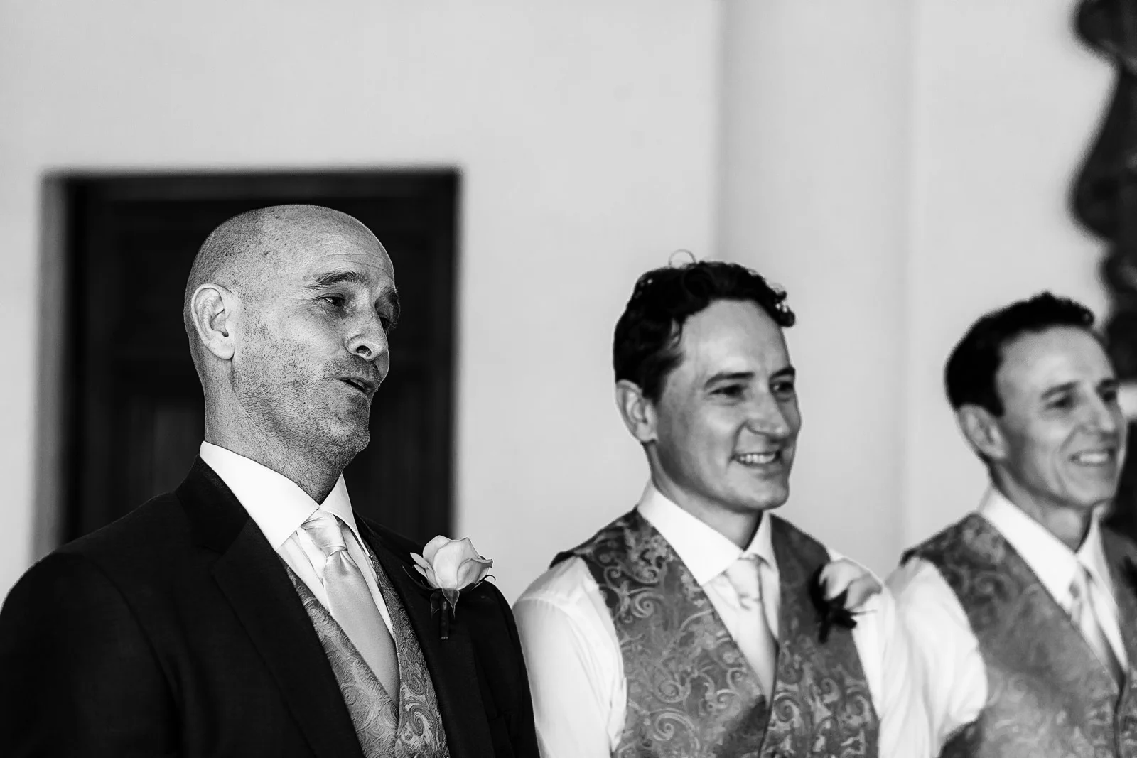 The groom is blown away by the beauty of the bride walking down the aisle