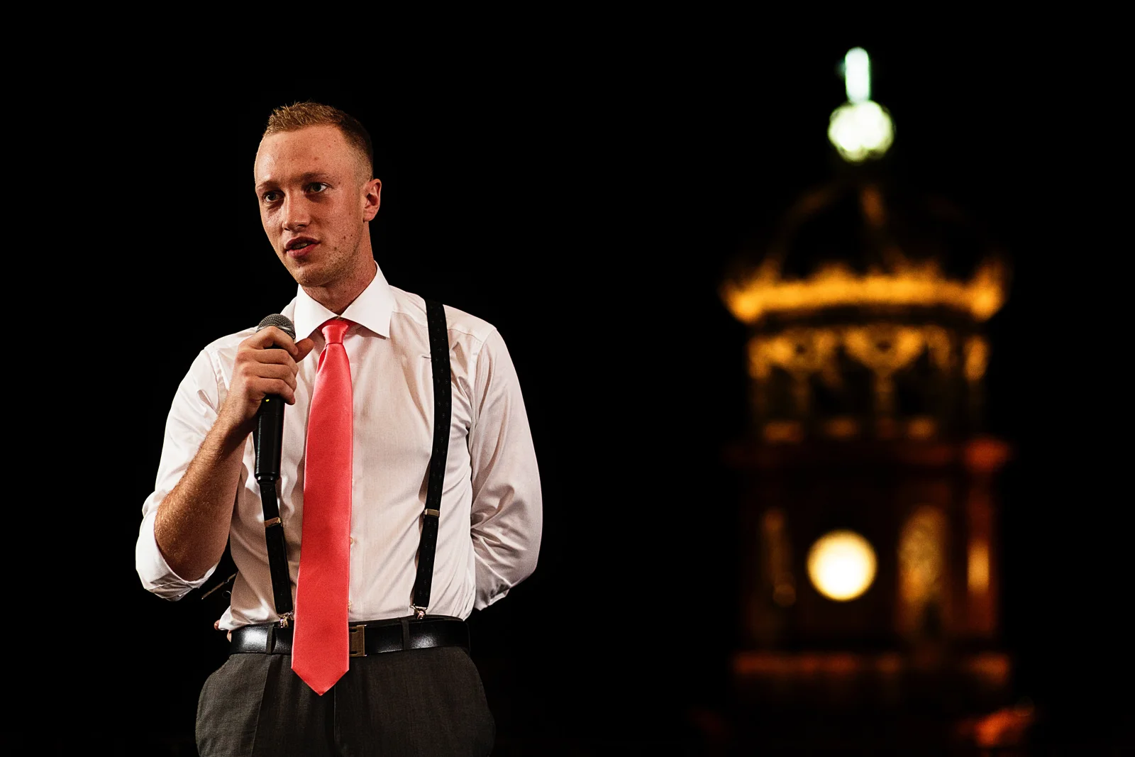 Son of the bride gives a speech during the reception of the wedding