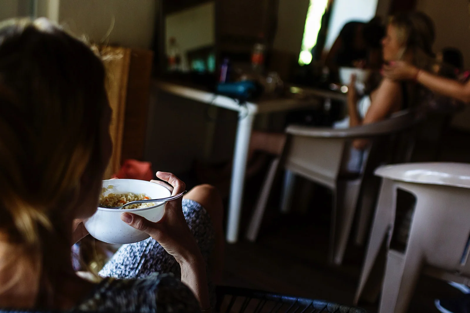 Bride and maid-of-honor getting ready and eating rice