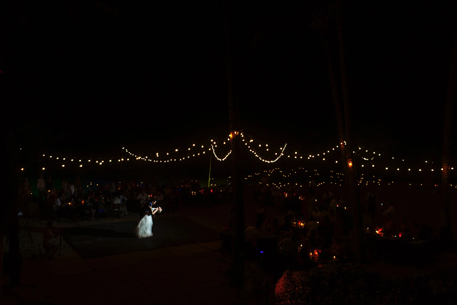 Groom step the bride at the end of their first dance