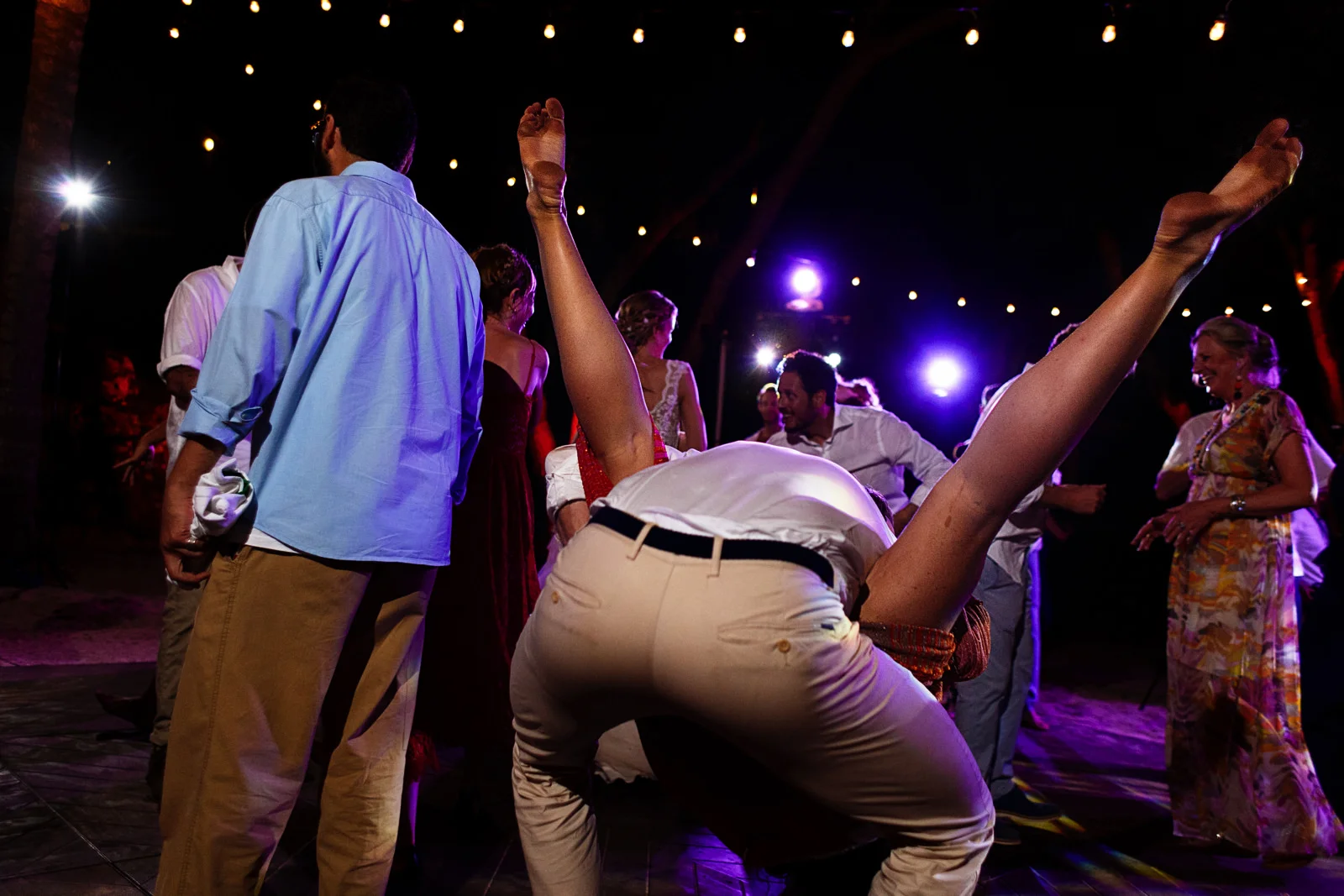 Crazy couple dance their feet in the air