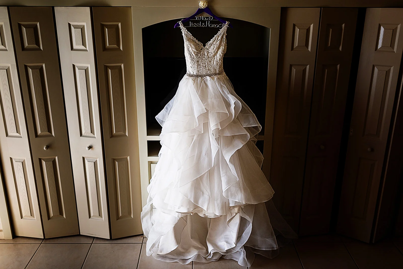 Wedding dress hanging in the room by itself
