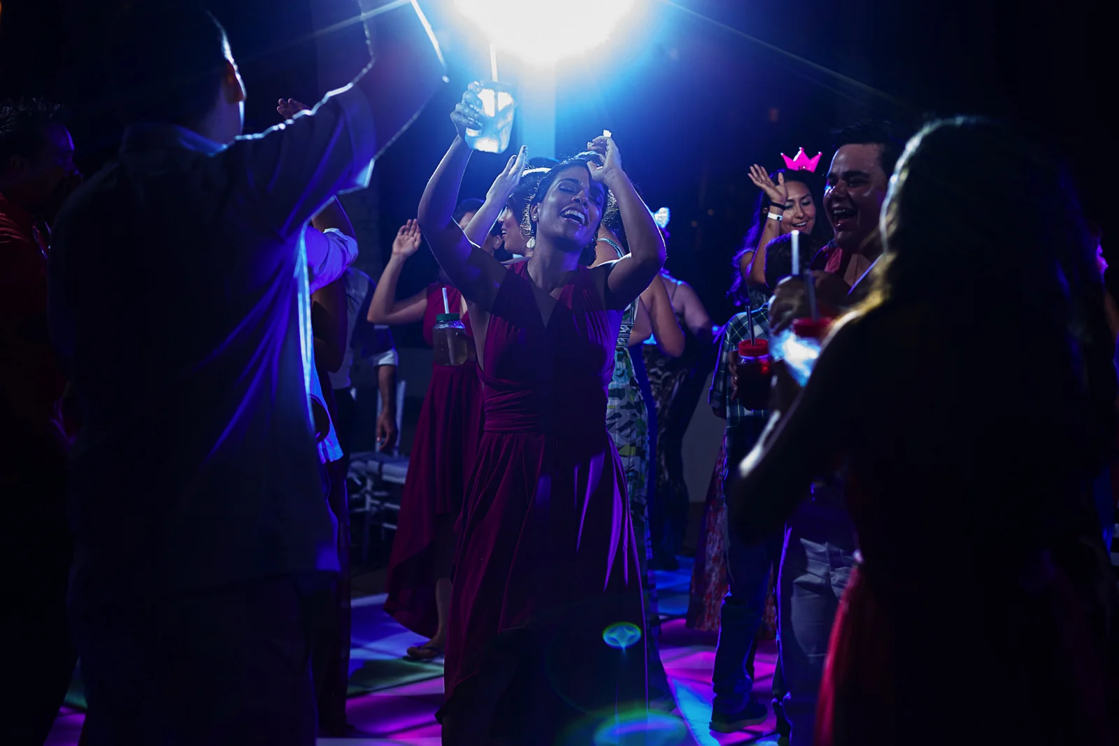 Wedding guest dancing under the shinny DJ lights