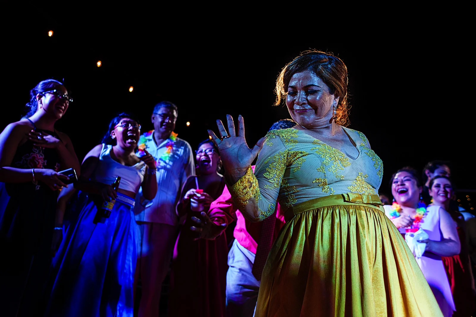 Mother of the bride showing her dance moves to the party crowd