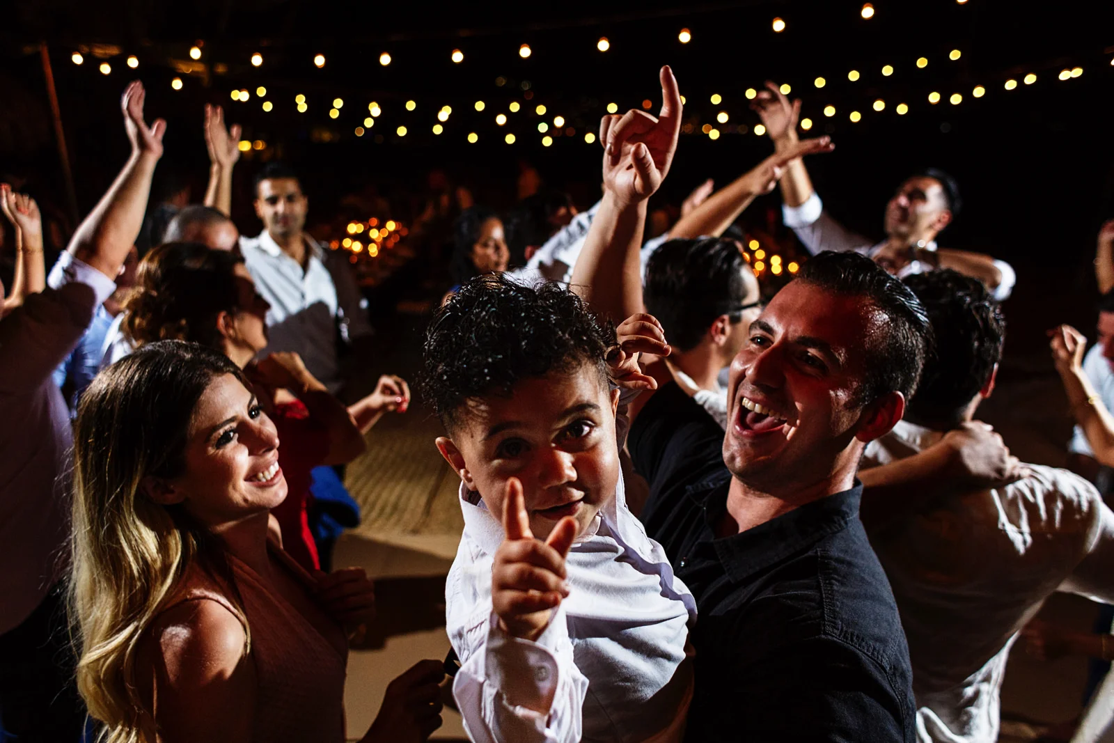 Toddler having a blast in the dance floor at the wedding party