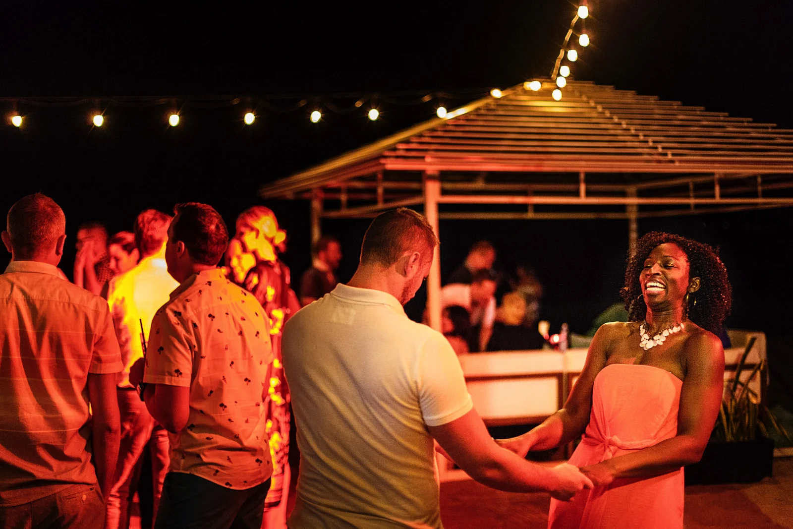 Wedding guests dancing at the welcome party in Mantamar