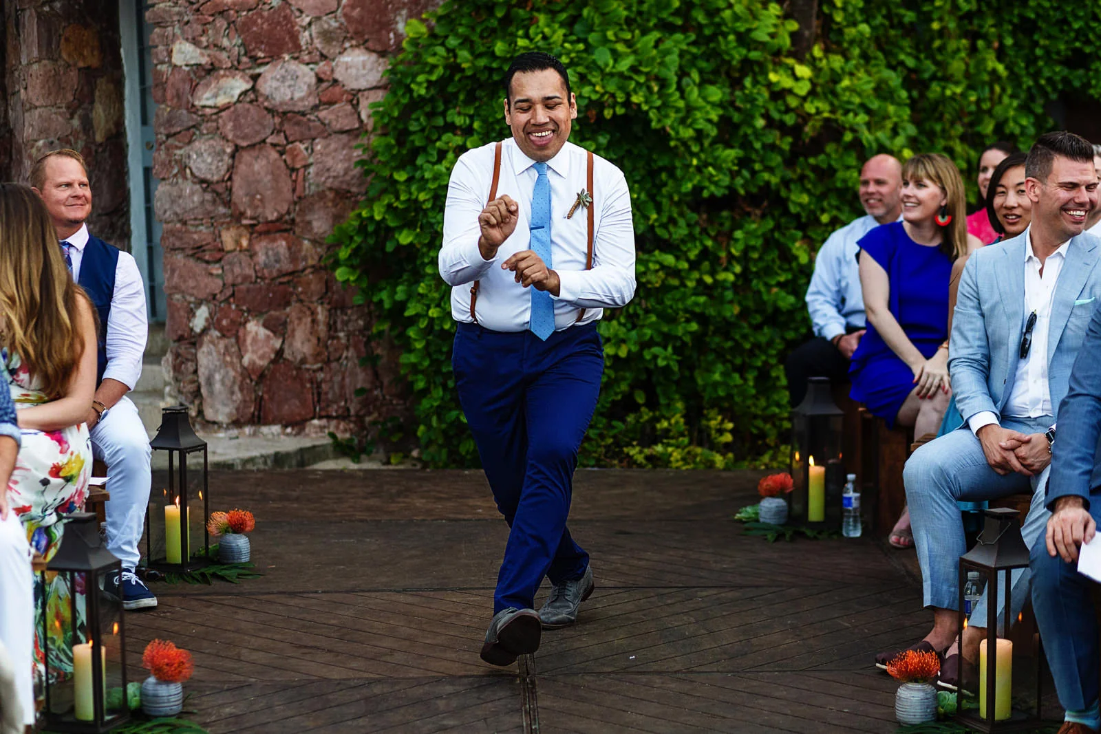 Groomsman funny entrance through the aisle for the ceremony