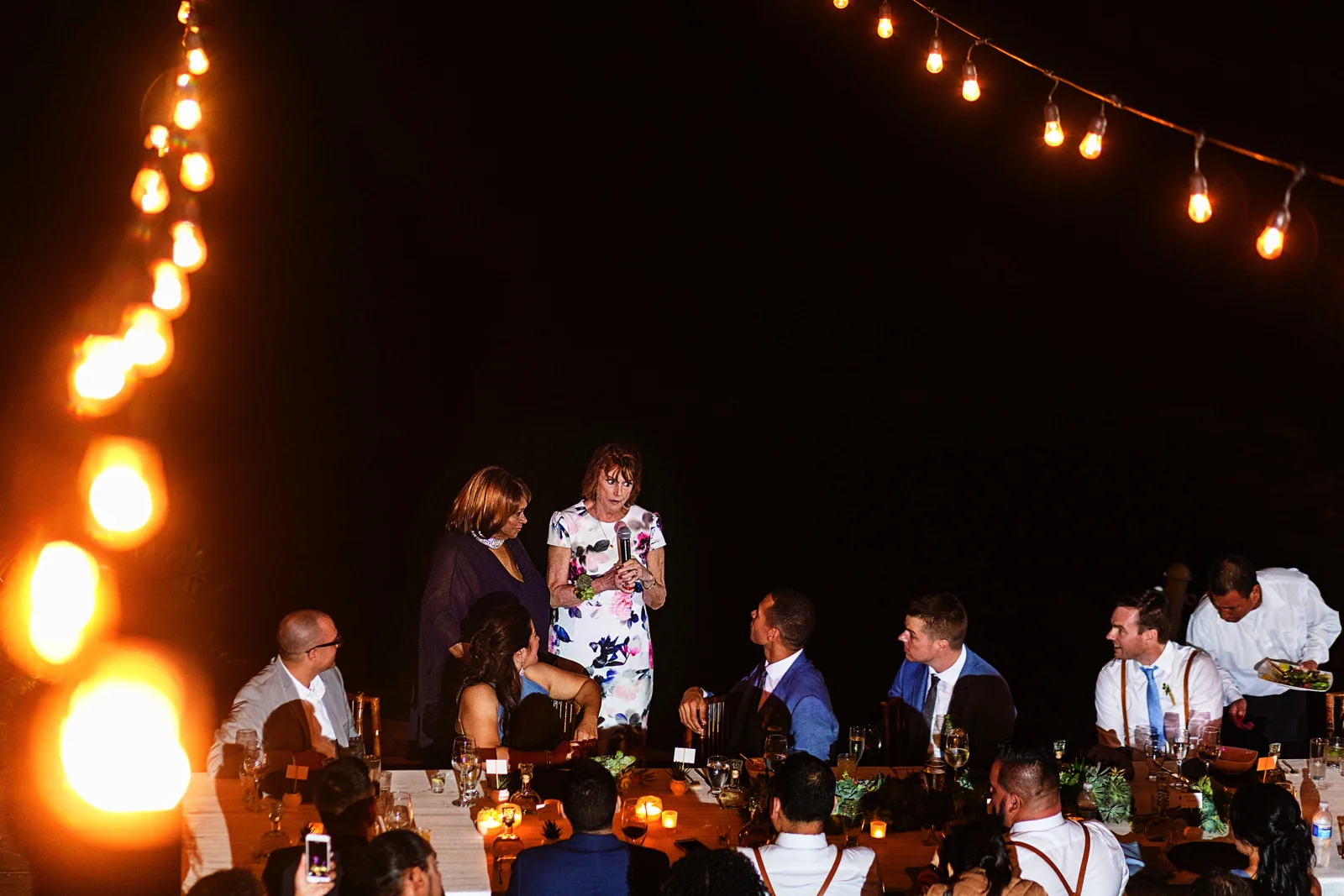 Mother of the groom giving a speech during wedding dinner